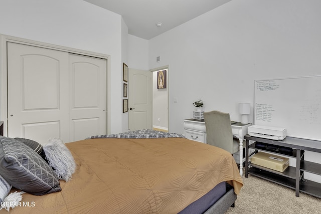 carpeted bedroom featuring a closet