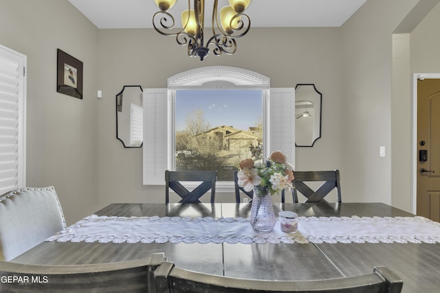 dining space featuring an inviting chandelier