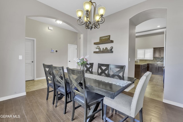 dining area featuring an inviting chandelier