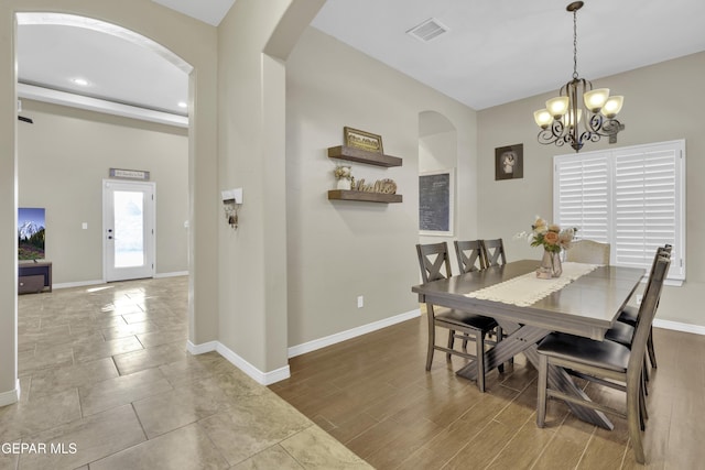 dining room with a notable chandelier