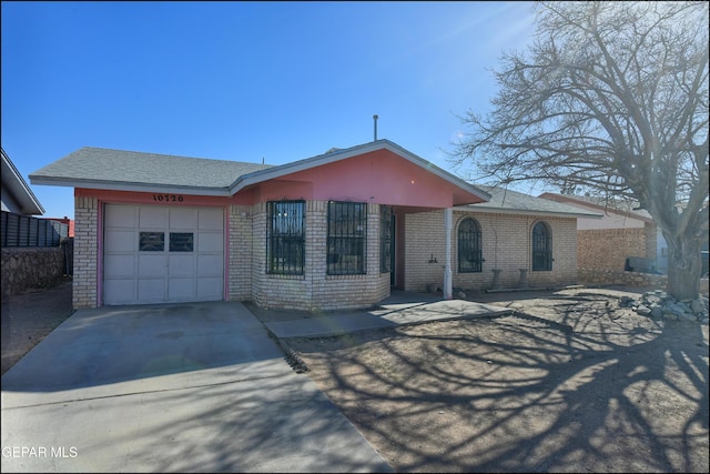 ranch-style house featuring a garage