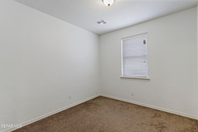 empty room with carpet flooring