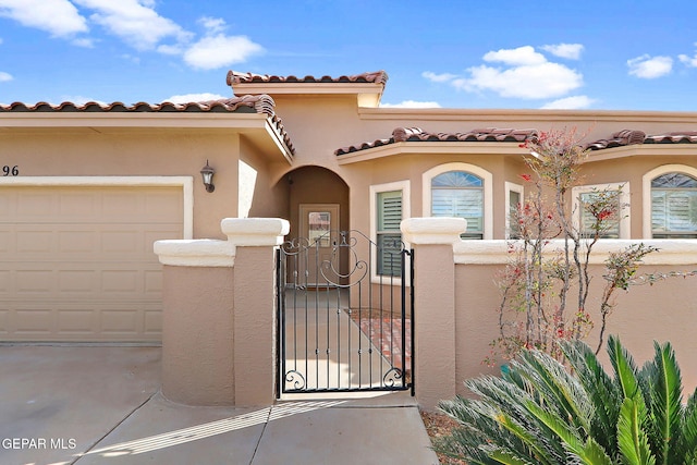 mediterranean / spanish house featuring a garage