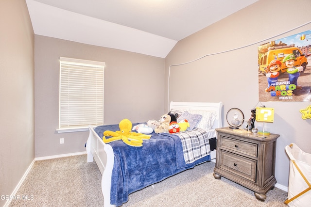 bedroom with lofted ceiling and carpet