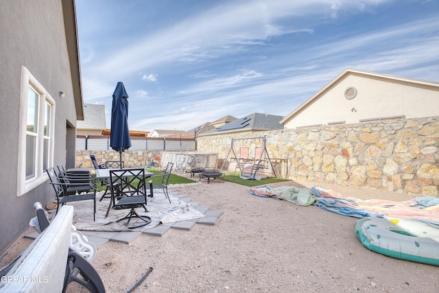 view of patio / terrace featuring a fire pit