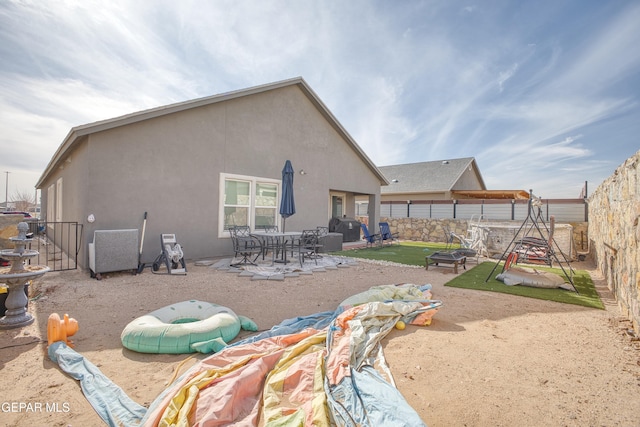 back of house with a patio