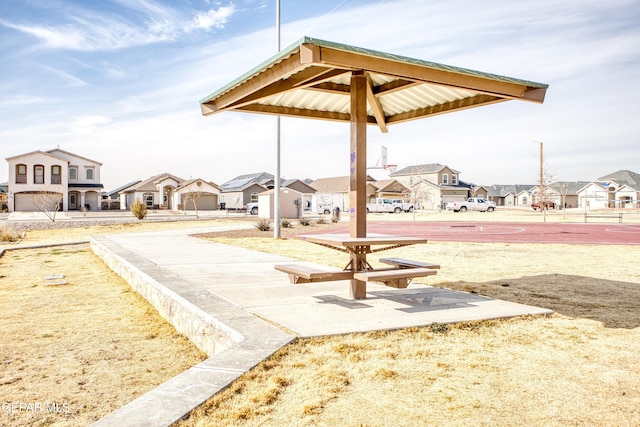 view of home's community with a gazebo and basketball hoop