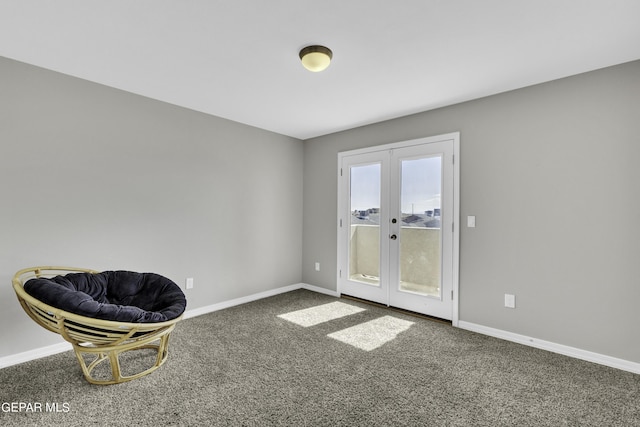 sitting room with french doors and carpet flooring