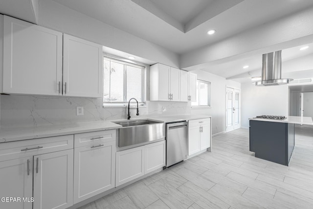 kitchen with white cabinets, stainless steel appliances, island exhaust hood, and tasteful backsplash