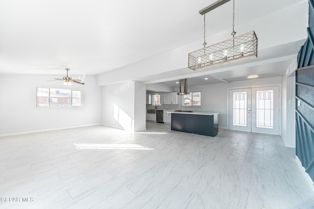 unfurnished living room featuring ceiling fan, french doors, and lofted ceiling