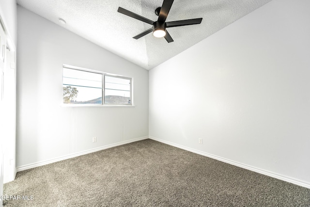 unfurnished room featuring carpet floors, ceiling fan, a textured ceiling, and lofted ceiling