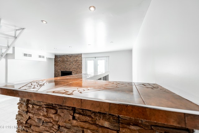 kitchen with a stone fireplace