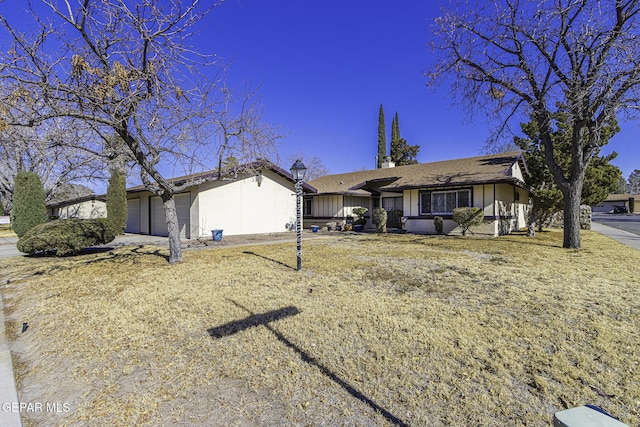 single story home with a garage