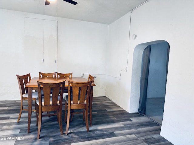 dining room featuring ceiling fan and dark hardwood / wood-style flooring