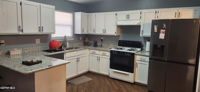 kitchen featuring sink, black appliances, and white cabinets