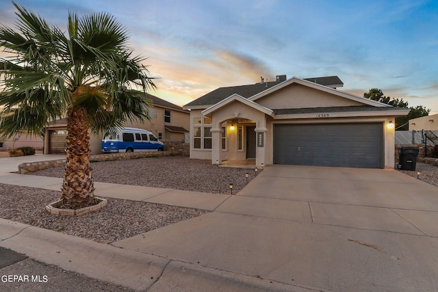 view of front of property with a garage