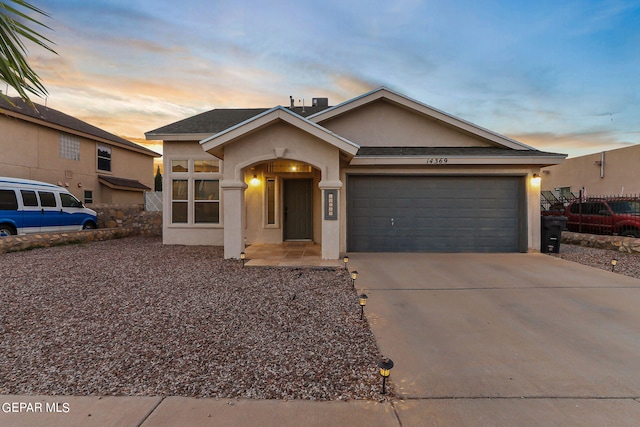 ranch-style home with a garage