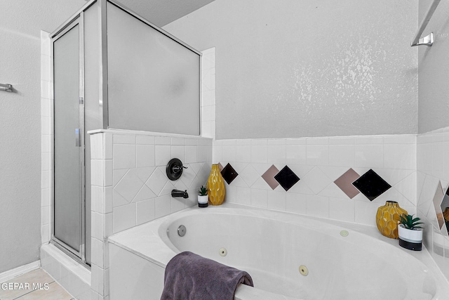 bathroom featuring a bath and tile patterned floors