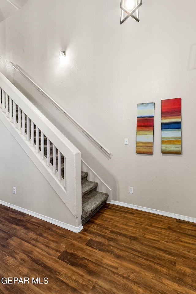 staircase featuring hardwood / wood-style flooring