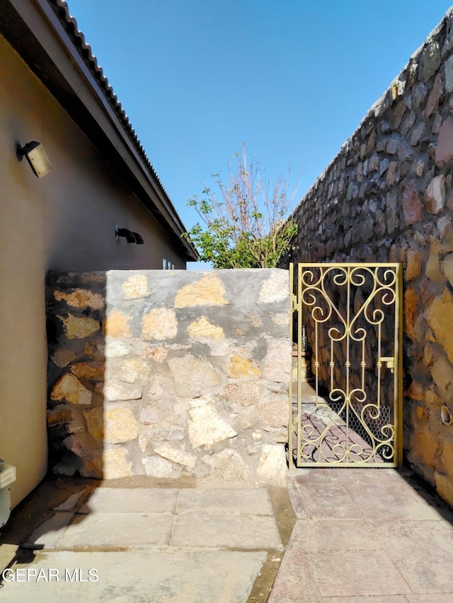 view of gate with fence