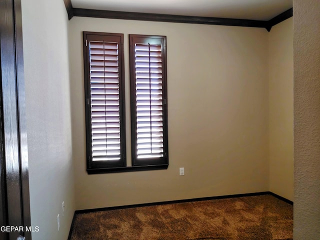 carpeted empty room with baseboards and ornamental molding