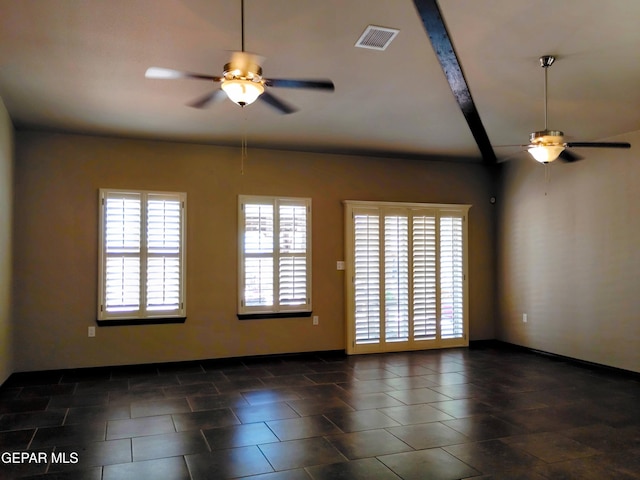 spare room featuring ceiling fan, baseboards, and visible vents