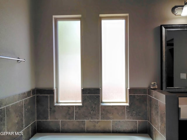 bathroom featuring a bath