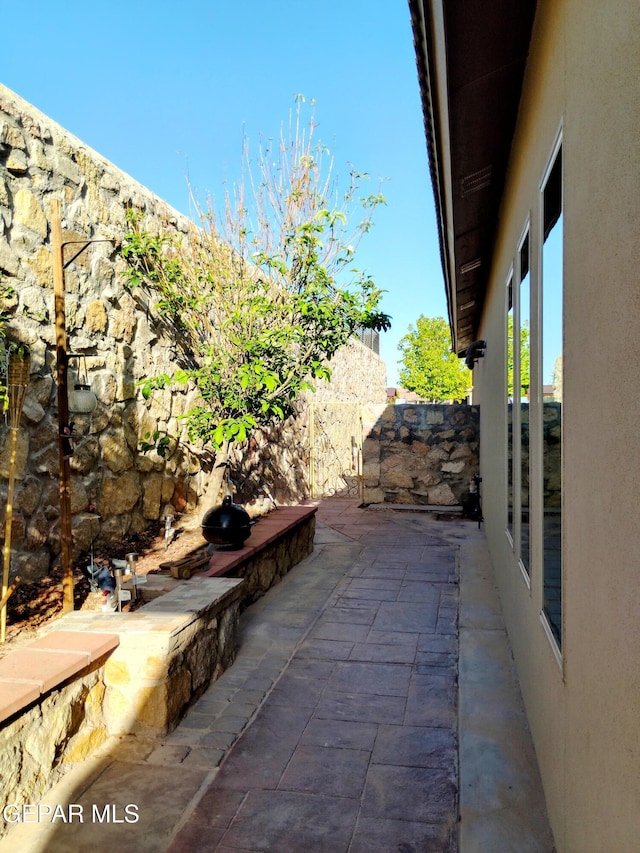 view of patio / terrace featuring fence