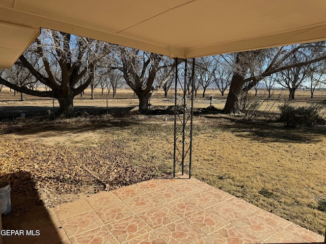 view of patio / terrace with a rural view