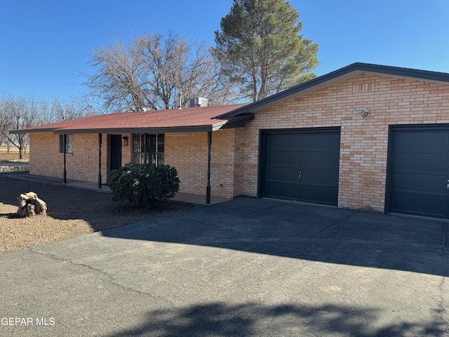 single story home with a garage