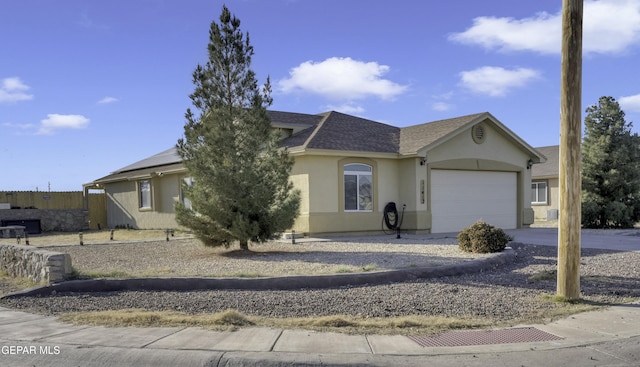 single story home featuring a garage