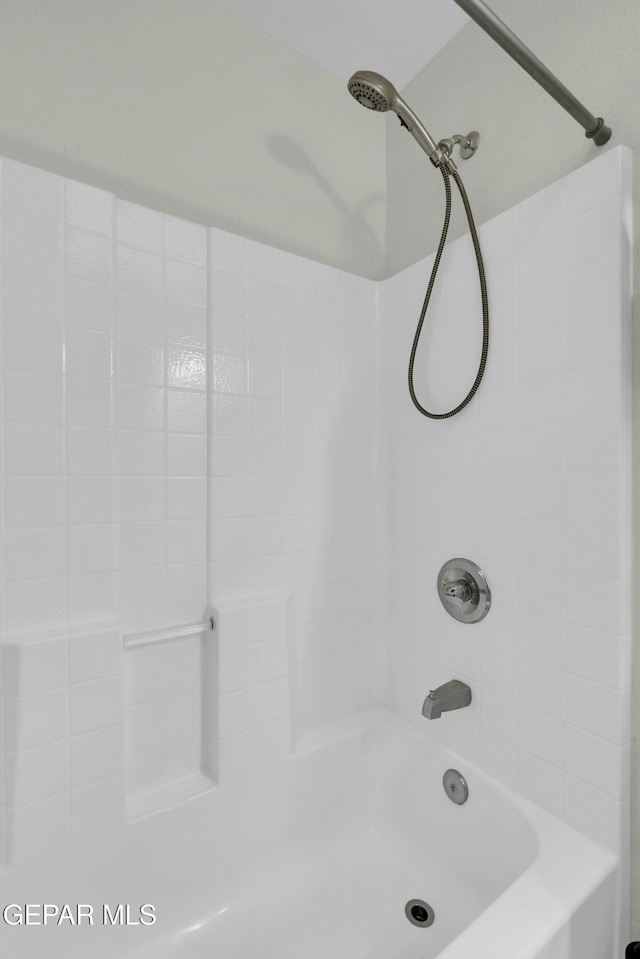 bathroom with shower / tub combination