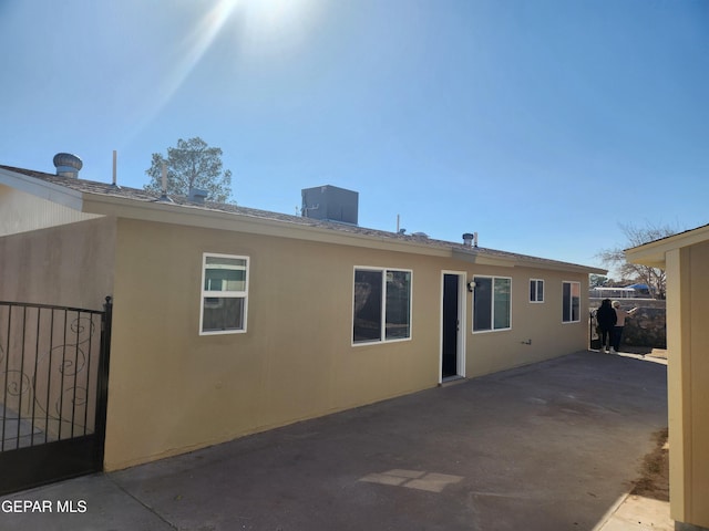 back of house with cooling unit and a patio area