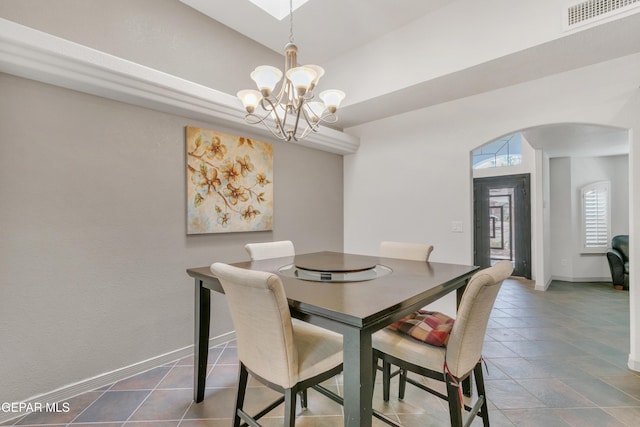 dining space with a notable chandelier