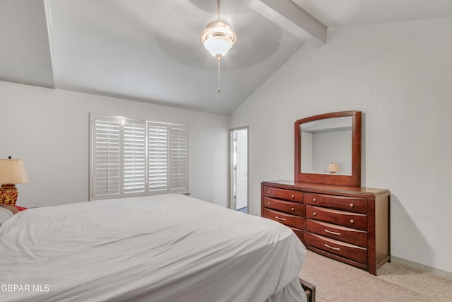 bedroom featuring ceiling fan, vaulted ceiling with beams, and light colored carpet