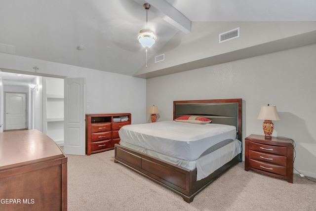 carpeted bedroom featuring ceiling fan and lofted ceiling with beams