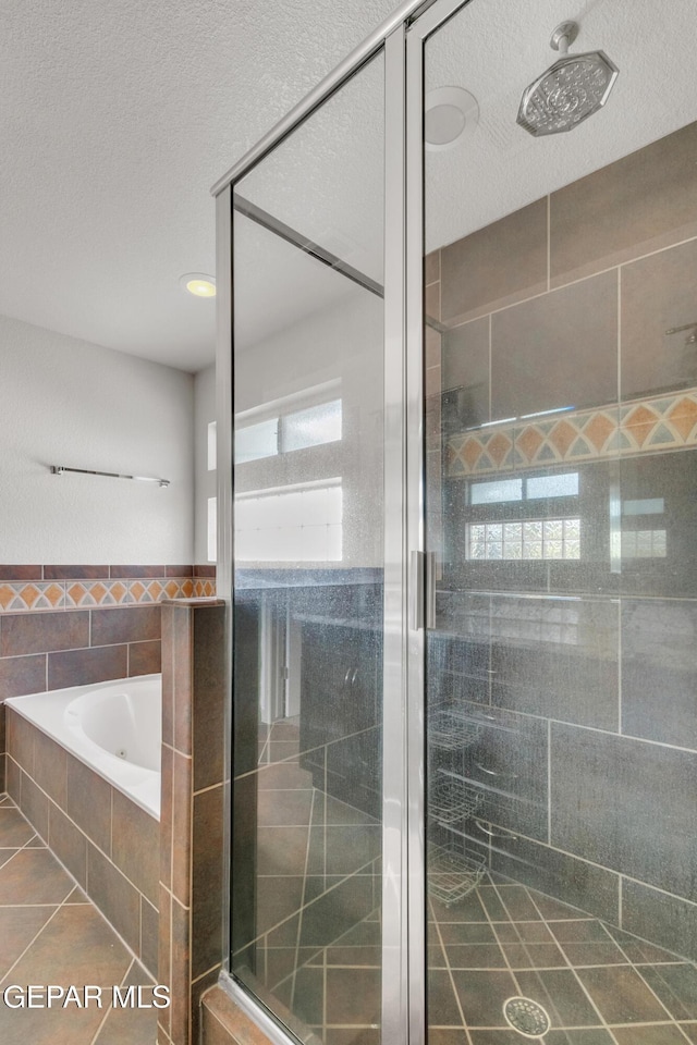 bathroom with plus walk in shower and tile patterned floors