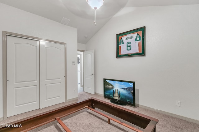 home office with carpet floors and vaulted ceiling