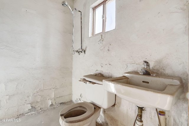 bathroom featuring sink and toilet