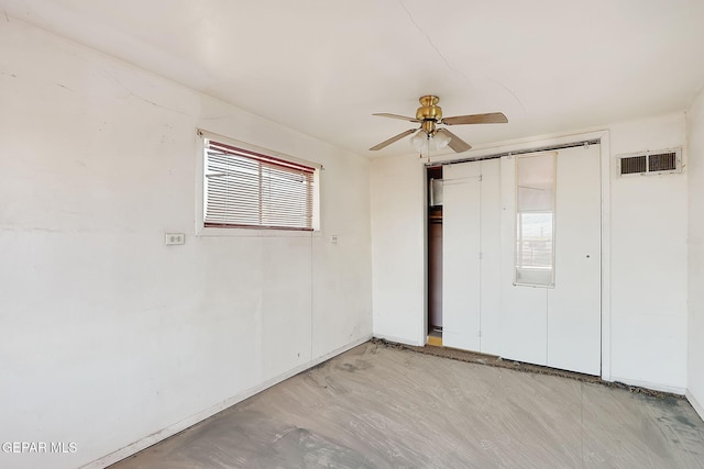 unfurnished room with ceiling fan