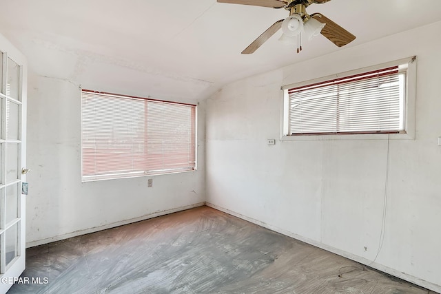 spare room with lofted ceiling and ceiling fan