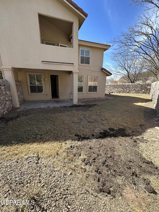 back of house with a patio