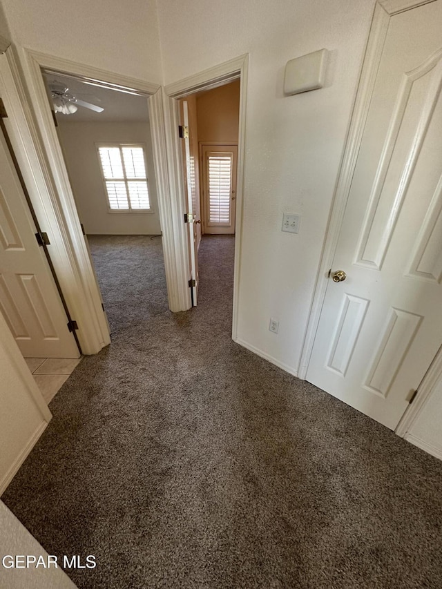 hall with carpet flooring