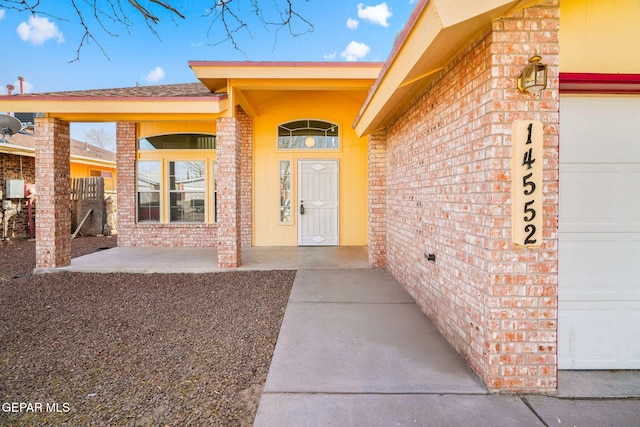 doorway to property featuring a garage