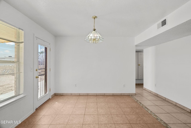 view of tiled spare room