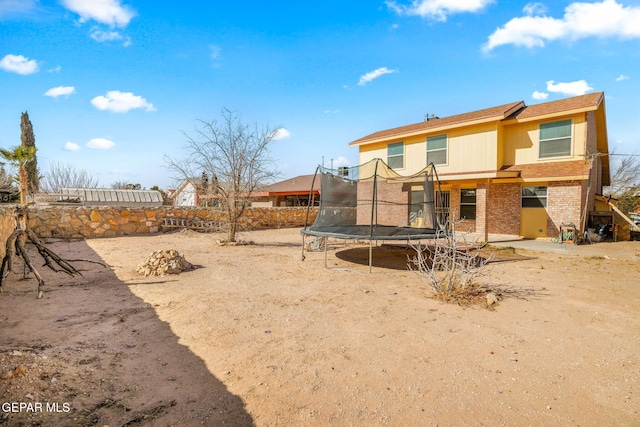 back of property with a trampoline