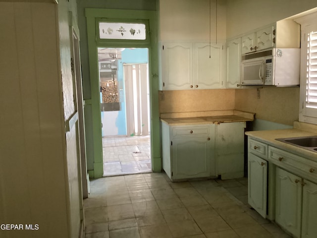 kitchen featuring white cabinets