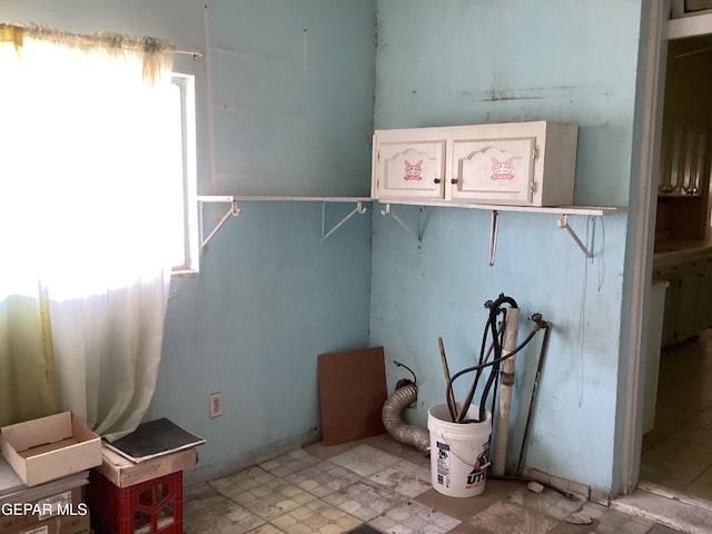 laundry room featuring washer hookup and a wealth of natural light