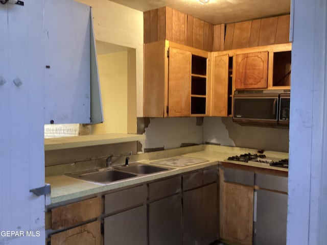 kitchen with sink and gas cooktop