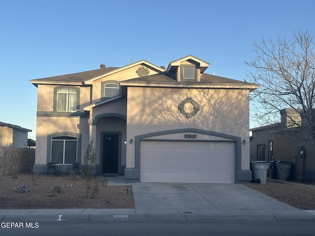 view of front of property with a garage